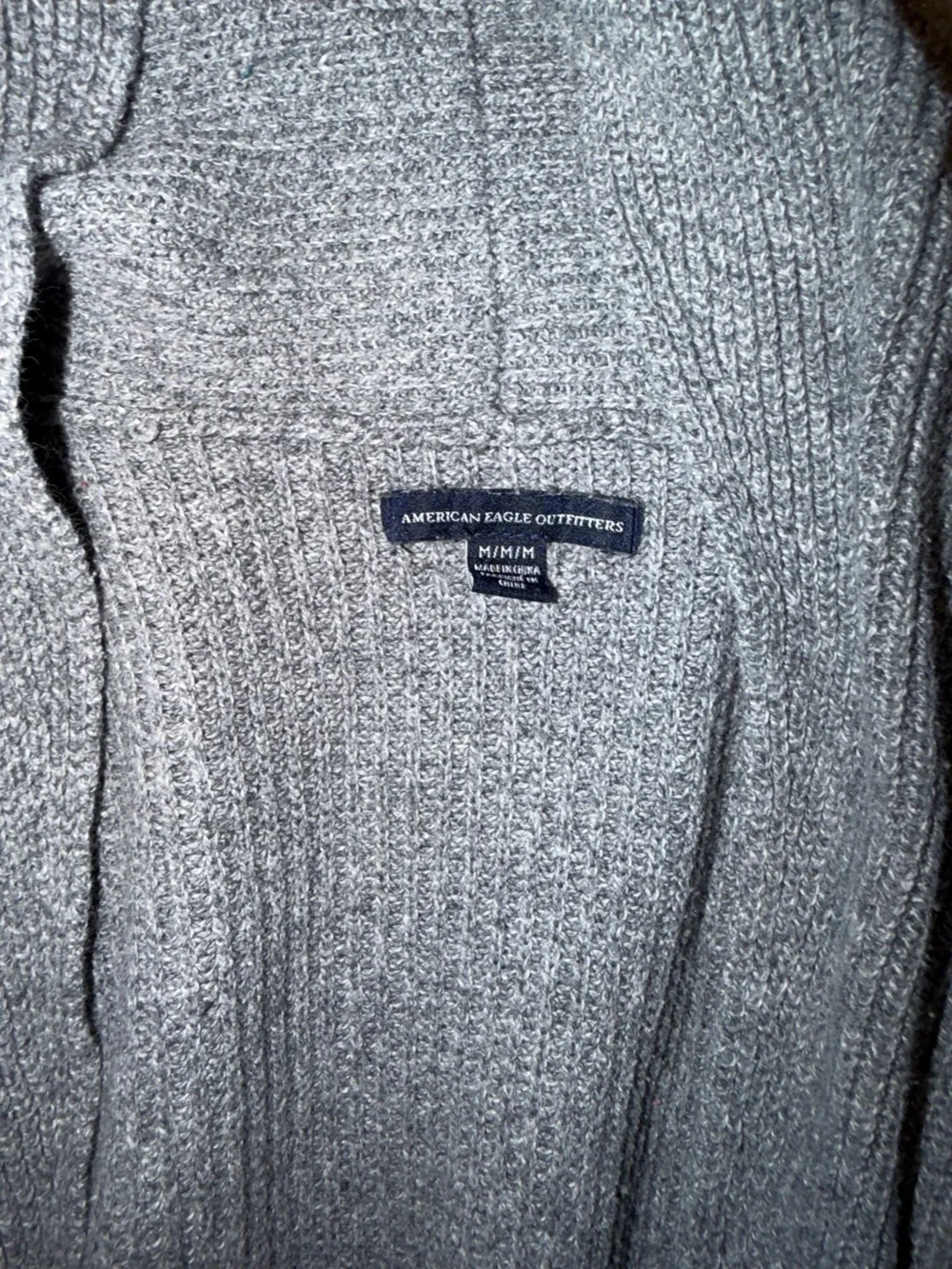 Gray Knit Cardigan with Black and White Stripe Cuffs